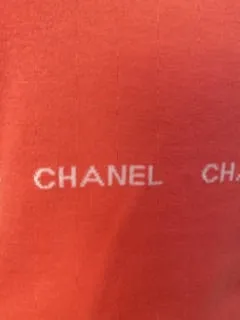 Chanel 04P, 2004 Spring Salmon/Orange Sleeveless sweater “Chanel" 8 times in design FR 42 US 8